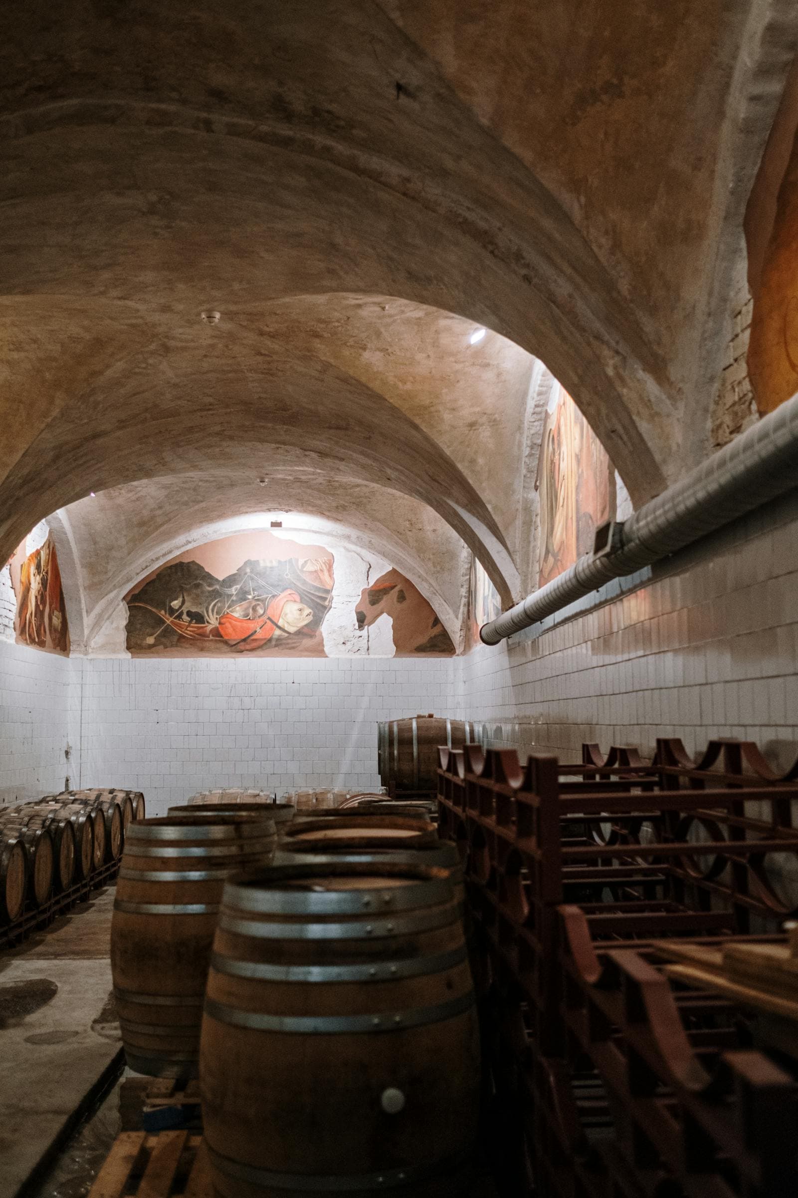 Wine cellar with reclaimed wood flooring under custom racking in Austin Texas